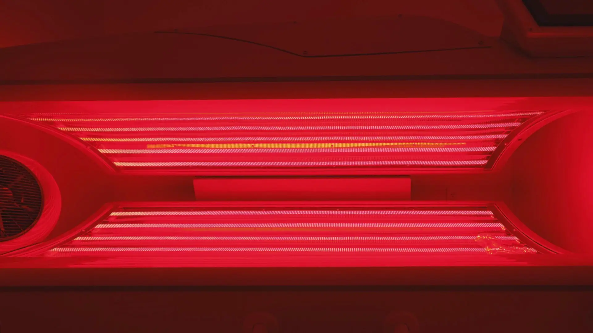 Whole-body red light therapy bed at RestFuel Wellness, providing full coverage light treatment in a peaceful, coastal-inspired setting.
