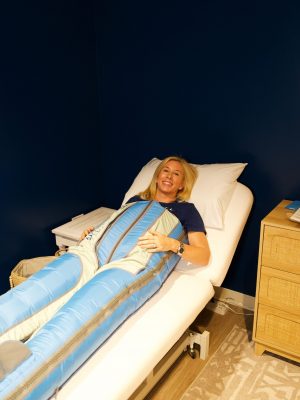 Lymphatic compression room at RestFuel Wellness featuring a Ballancer Pro suit on a treatment bed in a clean, coastal vibe.