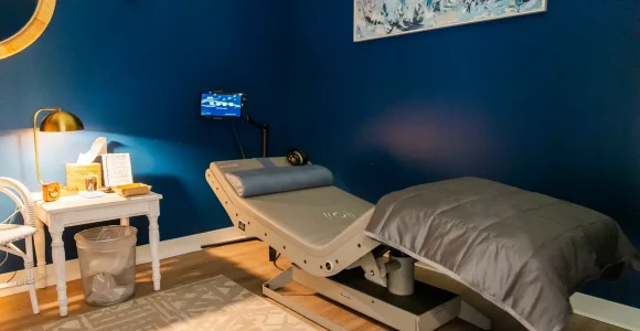 The Reset Chair at RestFuel Wellness, a modern recliner designed for vibroacoustic and relaxation therapy in a peaceful setting.