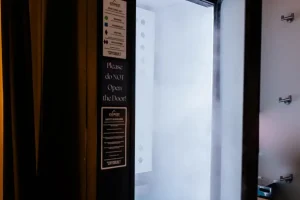 Cryotherapy chamber at RestFuel Wellness, featuring an evenly distributed cold chamber for whole-body cold therapy in a space with a clean, coastal vibe.