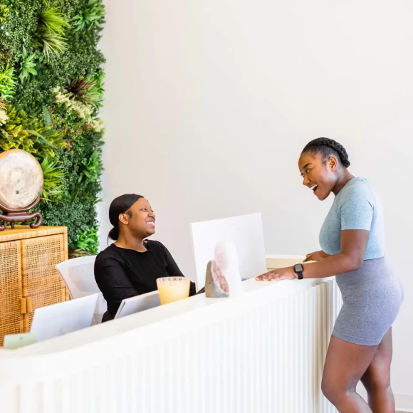 RestFuel front desk associate welcoming a client at front desk