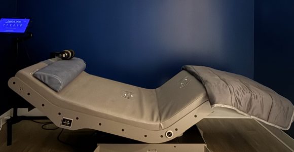 The Reset Chair at RestFuel Wellness, a modern recliner designed for vibroacoustic and relaxation therapy in a peaceful setting.