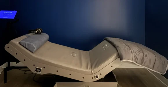 The Reset Chair at RestFuel Wellness, a modern recliner designed for vibroacoustic and relaxation therapy in a peaceful setting.